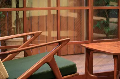 a pair of chairs and a table and a table and a window at Studio-D in Tokyo
