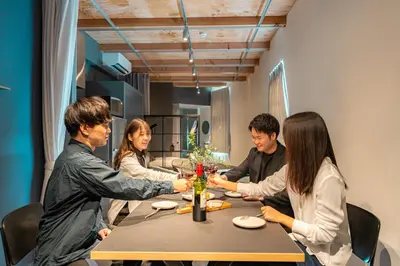 a group of people sitting around a table at Corent\u4ee3\u7530\u6a4b in Tokyo