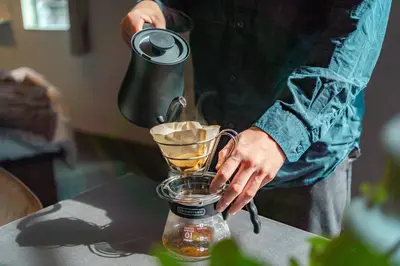 a man is making a drink in a blender at Corent\u4ee3\u7530\u6a4b in Tokyo