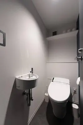 a bathroom with a white toilet and a sink at Corent\u4ee3\u7530\u6a4b in Tokyo