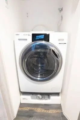 a washer and dryer in a white room at Corent\u4ee3\u7530\u6a4b in Tokyo