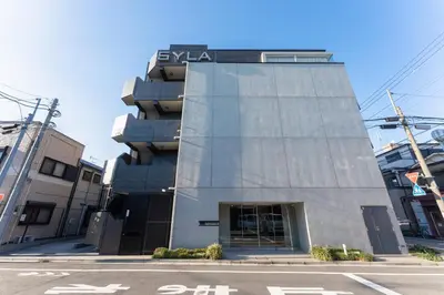 a building with a sign on the side of it at unito KEIKYU-KAMATA in Tokyo