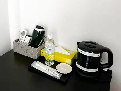 a counter top with a coffee maker and a coffee pot at D\u65c5\u9928\u3000Dryokan in Tokyo