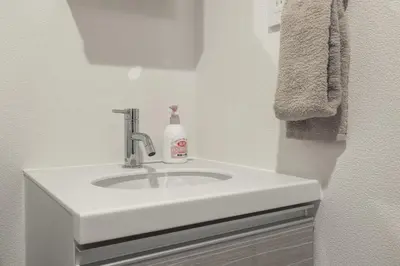 a white bathroom sink with a soap bottle on it at Marvelous Koiwa - Vacation STAY 44643v in Tokyo