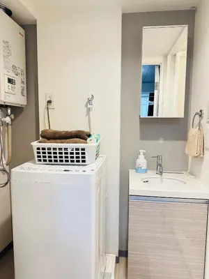 a bathroom with a washing machine and a sink at Marvelous Koiwa - Vacation STAY 44643v in Tokyo