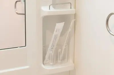 a white door with a drawer in a bathroom at EMILIO Nishi-Shinjuku Room 401 - Vacation STAY 89570v in Tokyo