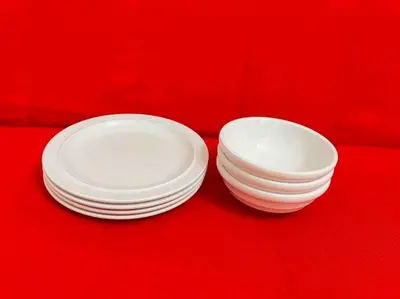 two stacks of white plates on a red background at 401 Oshiage sta 3mins walk! Wi-Fi Elevator 4pax in Tokyo