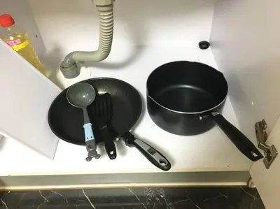 a kitchen counter with two utensils and a frying pan at 401 Oshiage sta 3mins walk! Wi-Fi Elevator 4pax in Tokyo