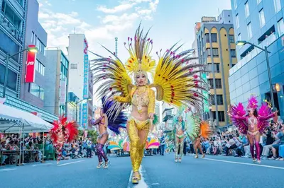 a group of people walking down a street in a parade at *301 Oshiage sta 3mins walk! Wi-Fi Elevator in Tokyo