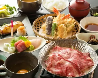 a table with plates of food and bowls of food at *301 Oshiage sta 3mins walk! Wi-Fi Elevator in Tokyo