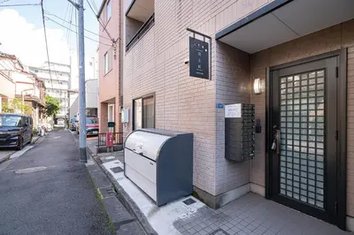 a refrigerator sitting on the side of a building at ZAITO Tokyo Luna Lane Inn \u83ca\u5ddd\u99c5\u304b\u3089\u5f92\u6b695\u5206 in Tokyo