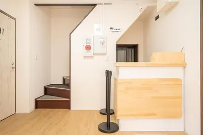 a room with a staircase and a stair case at ZAITO Tokyo Luna Lane Inn \u83ca\u5ddd\u99c5\u304b\u3089\u5f92\u6b695\u5206 in Tokyo