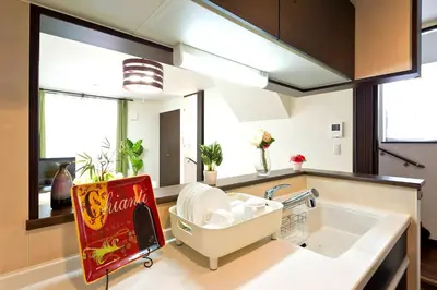 a kitchen with a cocacola cola sign next to a sink at 新宿顶级奢华三层独栋别墅/车站5分钟/儿童房/8人 in Tokyo