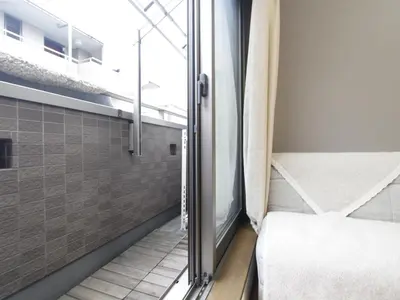a small room with a window and a bed at \u548c\u8cb4\u30d3\u30eb in Tokyo