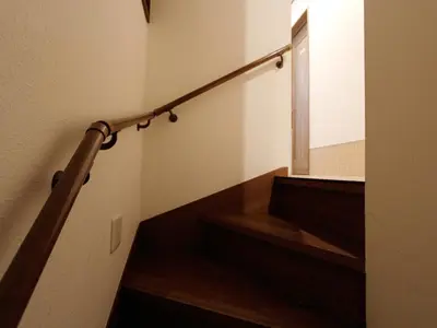 a staircase with a window and a stair railing at \u548c\u8cb4\u30d3\u30eb in Tokyo