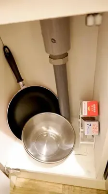 a kitchen sink with a metal bowl in a counter at The Hotel SPACE \u4e0b\u5317\u6ca2 in Tokyo