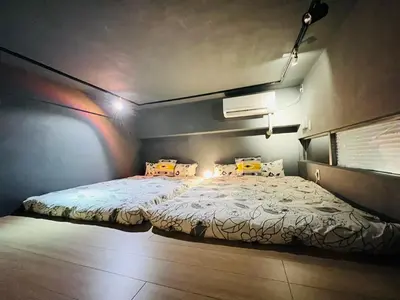 a bedroom with a large bed in a room at Ueno house-TT0135 in Tokyo