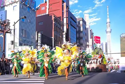 a group of women in costumes walking down a city street at 503 Oshiage sta 3mins walk! Wi-Fi & Elevator 4pax in Tokyo