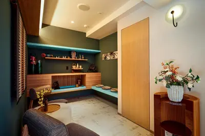 a living room with a couch and a table at LiveGRACE Hotel Azabu \u9ebb\u5e03\u829d\u516c\u5712 in Tokyo