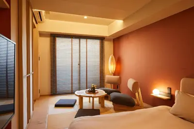 a room with a bed and a table and a window at LiveGRACE Hotel Azabu \u9ebb\u5e03\u829d\u516c\u5712 in Tokyo