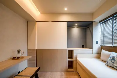 a small bedroom with a bed and a desk at LiveGRACE Hotel Azabu \u9ebb\u5e03\u829d\u516c\u5712 in Tokyo