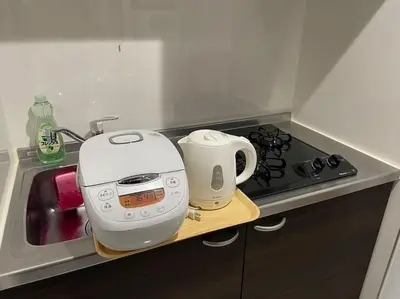 a toaster sitting on top of a kitchen counter at 403 Oshiage sta 3mins walk! Wi-Fi & Elevator 4pax in Tokyo