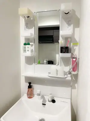 a white bathroom with a sink and a mirror at 403 Oshiage sta 3mins walk! Wi-Fi & Elevator 4pax in Tokyo