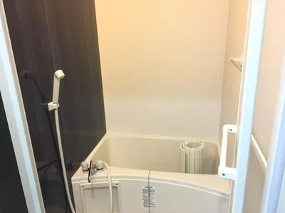 a white bath tub in a small bathroom at *201 Oshiage sta 3mins! Wi-Fi & Elevator 4pax in Tokyo