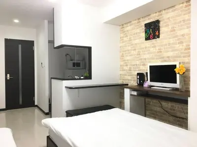 a room with a kitchen with a computer monitor on a counter at *201 Oshiage sta 3mins! Wi-Fi & Elevator 4pax in Tokyo