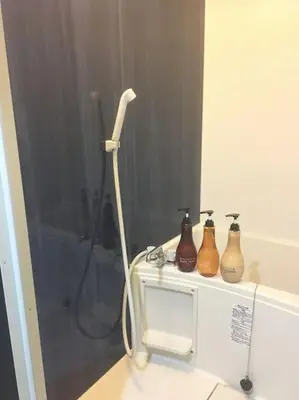 a bathroom with a stand up shower with three vases at *201 Oshiage sta 3mins! Wi-Fi & Elevator 4pax in Tokyo
