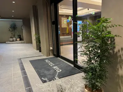 a door mat with the word exit on it in a lobby at Hotel RIO\u65b0\u5bbf in Tokyo