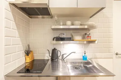 a kitchen with a sink and a counter top at GrandTree Hotel - Specutaclor Skytree view! in Tokyo