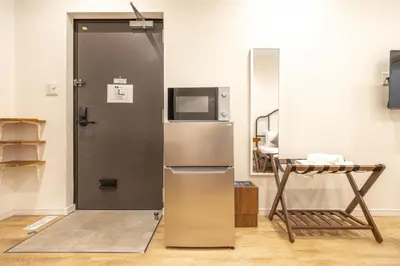 a refrigerator with a television on top of it at GrandTree Hotel - Specutaclor Skytree view! in Tokyo
