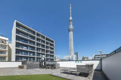 a view of the eiffel tower from the rooftop of a building at GrandTree Hotel - Specutaclor Skytree view! in Tokyo