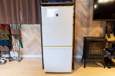 a white refrigerator in a room with a stove at AIC\u6c60\u888b502 in Tokyo