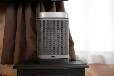 a black and white speaker sitting on top of a table at AIC\u6c60\u888b502 in Tokyo