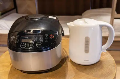a toaster and a coffee pot on a table at AIC\u6c60\u888b502 in Tokyo