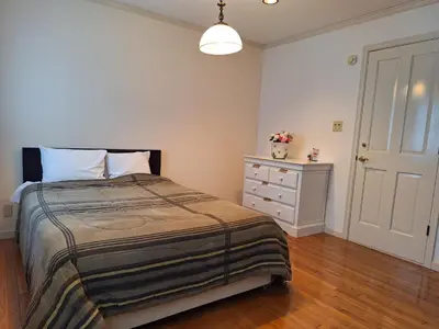a bedroom with a bed and a dresser at Urban Residence Ikebukuro East in Tokyo