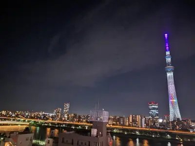 a view of the eiffel tower at night at HOTEL TOMOS ASAKUSA in Tokyo