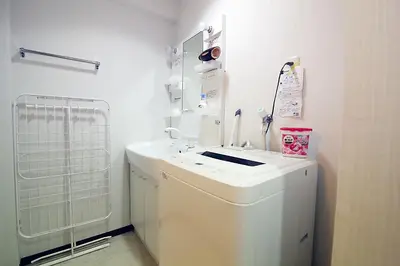 a white laundry room with a washer and dryer at EMA House 4P Free Wifi! in Tokyo
