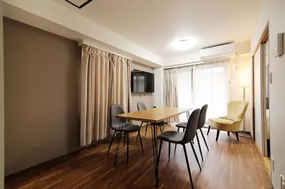 a dining room with a table and chairs at EMA House 4P Free Wifi! in Tokyo