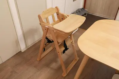 a wooden chair sitting next to a table at Vermidor Ebisu302 in Tokyo