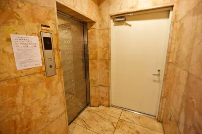 a bathroom with a door and a walk in shower at Vermidor Ebisu302 in Tokyo