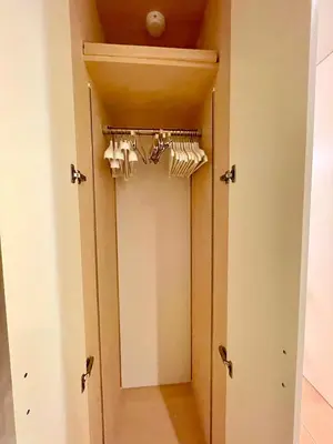 a room with a closet with a door with a mirror at SALON\u6e0b\u8c374B in Tokyo