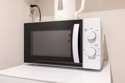 a microwave oven sitting on top of a counter at Sky Kinshicho in Tokyo