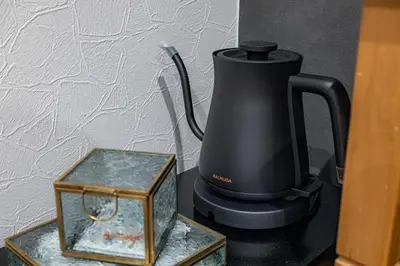 a black blender sitting on a table next to a box at Inn The Omotesando in Tokyo