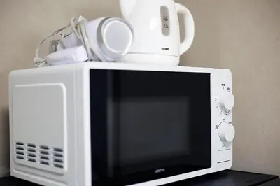 a microwave with a blender on top of it at Shinjuku! Hayashi House 3P Free Wi-fi! in Tokyo