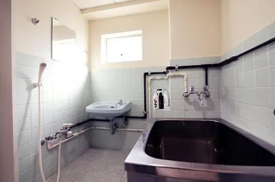 a bathroom with a sink and a bath tub at Shinjuku! Hayashi House 3P Free Wi-fi! in Tokyo