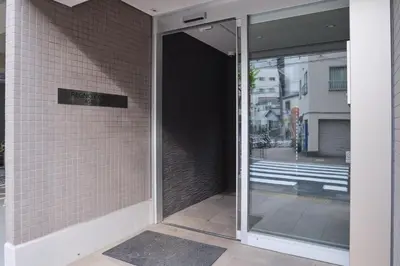an open door to a building with a sign on it at Regnocomfort Asakusa 3 - Vacation STAY 57925v in Tokyo