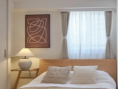 a bedroom with a bed and a window at Regnocomfort Asakusa 3 - Vacation STAY 61882v in Tokyo